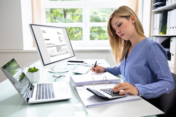 A woman reviews real estate investment options. 
