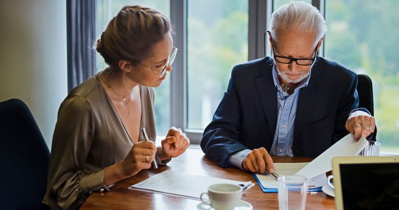 A couple reviewing their portfolio strategy to build wealth.