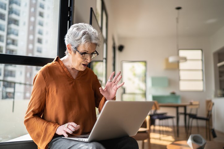 A woman reviewing her CD investments.