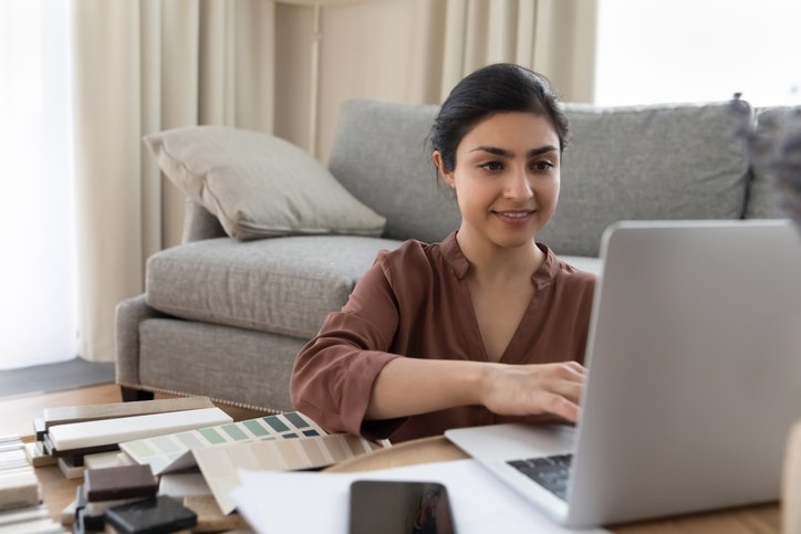 A woman researching how to use debt to build wealth.